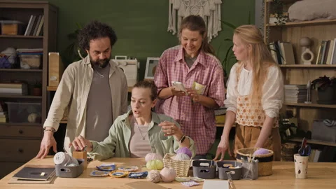 Creative Team of Colleagues Discussing Handmade Craft Project Stock Footage 341955535