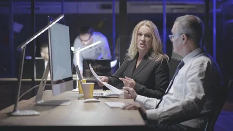 Creative team with computers working together late at night office Stock Footage 125683660