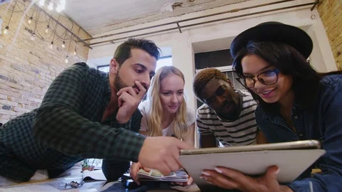 Creative Team of Designers Discussing Project on Digital Tablet Stock Footage 115462231