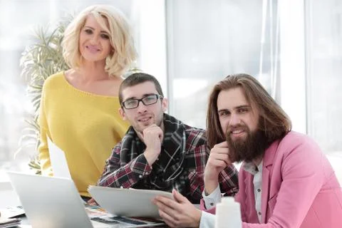 Creative team of designers in the workplace in the Studio Foto stock