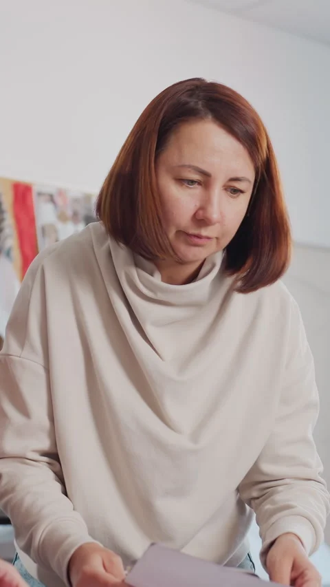 Creative team discusses fabric samples, Studio professionals analyze textiles Stock Footage 330799061
