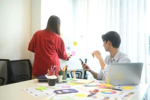 Creative team discussing app development ideas during meeting Stock Photos