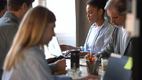 Creative team discussing new project. Casual young people in new business office Stock Footage 171787827