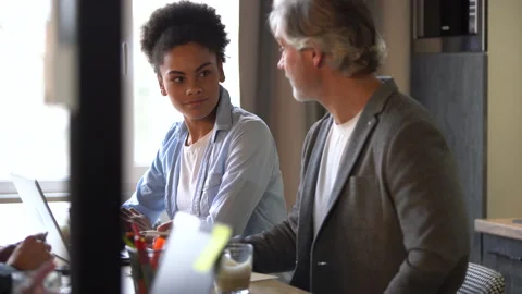 Creative team discussing new project. Casual young people in new business office Stock Footage 171787879