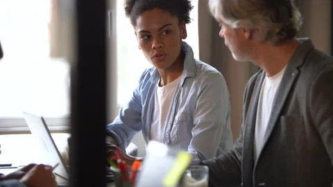 Creative team discussing new project. Casual young people in new business office Stock Footage 171787972