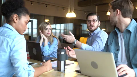 Creative team discussing new project. Casual young people in new business office Stock Footage 171788562