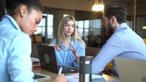 Creative team discussing new project. Casual young people in new business office Stock Footage 171788618