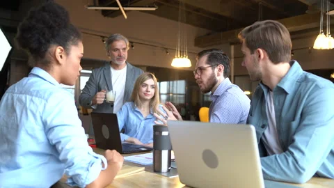 Creative team discussing new project. Casual young people in new business office Stock Footage 171788700