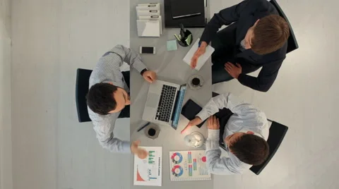 Creative team displaying charts  with laptop and tablet pc computers sitting at 스톡 동영상 58169495