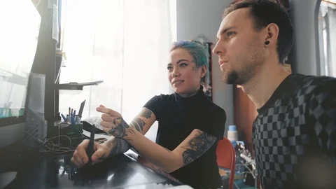 Creative team having a discussion about pictures on the computer screen. Stock Footage 88912430