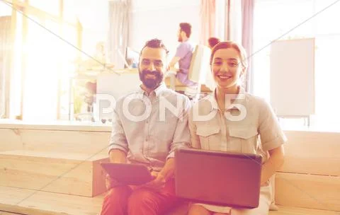 Creative team with laptop and tablet pc at office Stock Photos