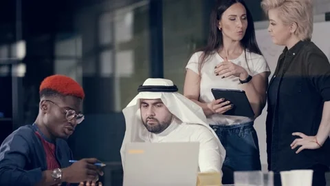 Creative team of people of different races is working with concentration in a Stock Footage 140919214