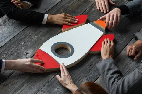 Creative team with startup rocket Stock Photos