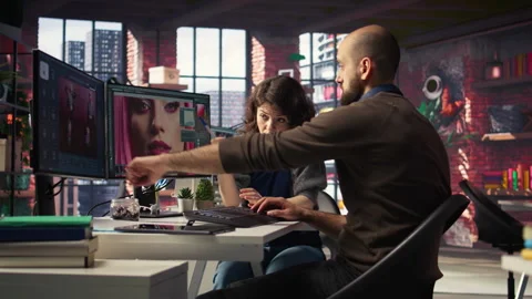 Creative team work with AI chatbot and editing software to improve content Vídeos de archivo 308603770