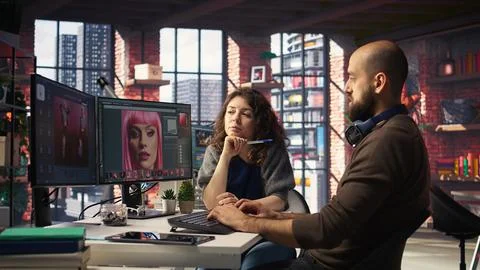 Creative team work with AI chatbot and editing software to improve content Stock Photos