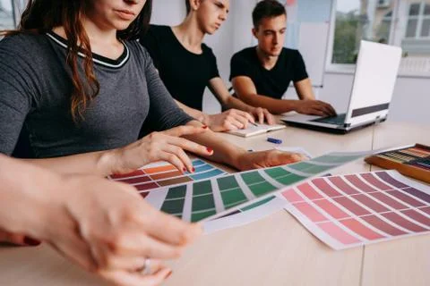 Creative team working together at design studio Stock Photos