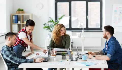 Creative team working on user interface at office Stock Photos