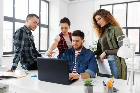Creative team working on user interface at office Stock Photos