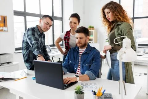 Creative team working on user interface at office Stock Photos