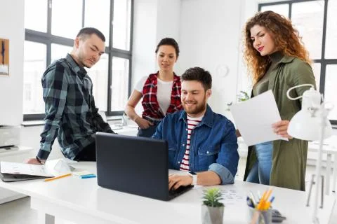 Creative team working on user interface at office Stock Photos