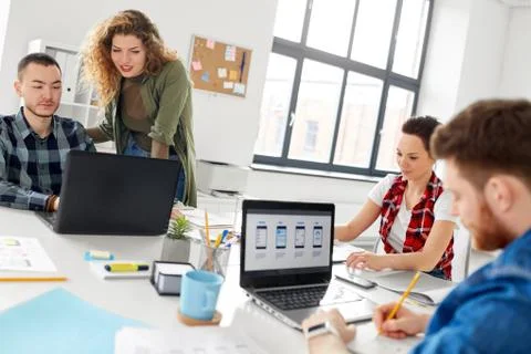 Creative team working on user interface at office 스톡 사진
