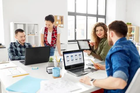 Creative team working on user interface at office Foto stock
