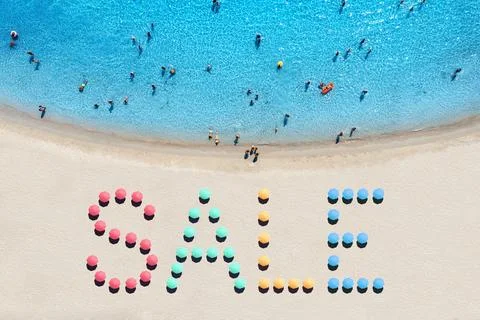 Creative text made from umbrellas on sandy beach and blue sea Stock-Fotos
