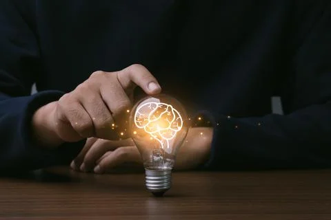 Creative thinking idea for Technology concept.Hand of man touching light bu.. Stock Photos