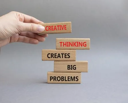 Creative Thinking symbol. Wooden blocks with words Creative Thinking Solves.. Stock Photos
