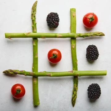 Creative Tic Tac Toe Made with Fresh Vegetables Stock Photos