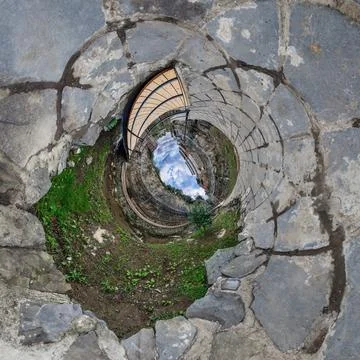 Creative tiny planet photo of a rural landscape with dirt road, green fields, Stock-Fotos