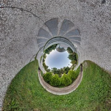 Creative tiny planet photo of a rural landscape with dirt road, green fields, Stock Photos