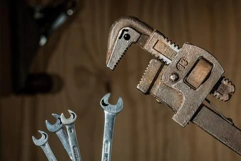 Creative Tool Composition with Wrenches and Pipe Wrench Foto stock