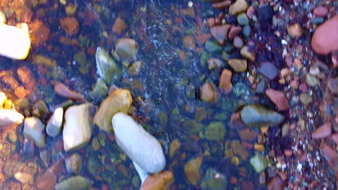 Creative Top Down Drone Shot of Stones Under Running Waterway Stock Footage 229748810