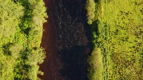 Creative Top Down Vertical Drone Shot of moving Waterway with Rocks Stock Footage 229748788