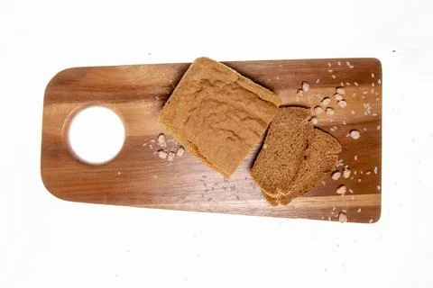Creative Top-View Composition: Rustic Brown Bread &amp; Seeds on a Wooden Cutti.. Stock Photos