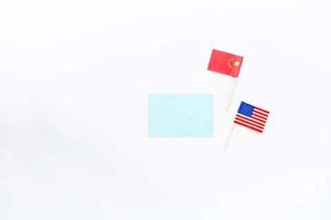 Creative top view flat lay of China and USA flag, mockup and copy space on wh Foto stock