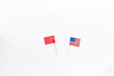 Creative top view flat lay of China and USA flag, mockup and copy space on wh Stock-Fotos
