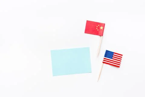Creative top view flat lay of China and USA flag, mockup and copy space on wh Stock Photos