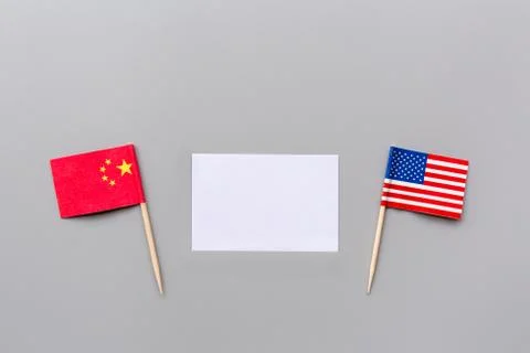 Creative top view flat lay of China and USA flags, mockup and copy space on g Stock Photos