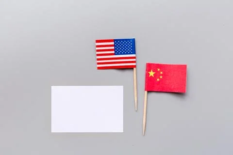 Creative top view flat lay of China and USA flags, mockup and copy space on g Stock Photos