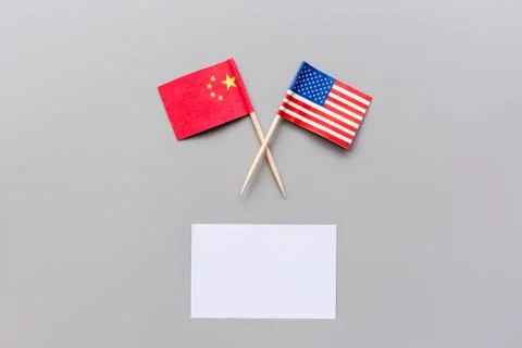 Creative top view flat lay of China and USA flags, mockup and copy space on g Stock Photos