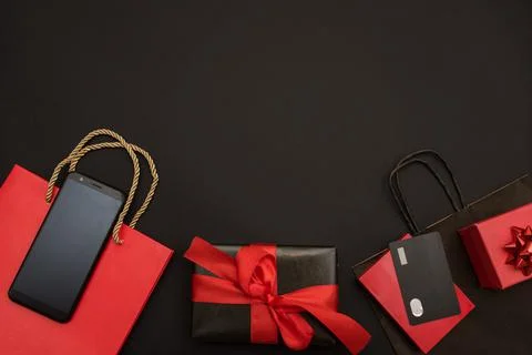 Creative top view, flat view for online shopping, bank card, phone, gift boxes Stock Photos