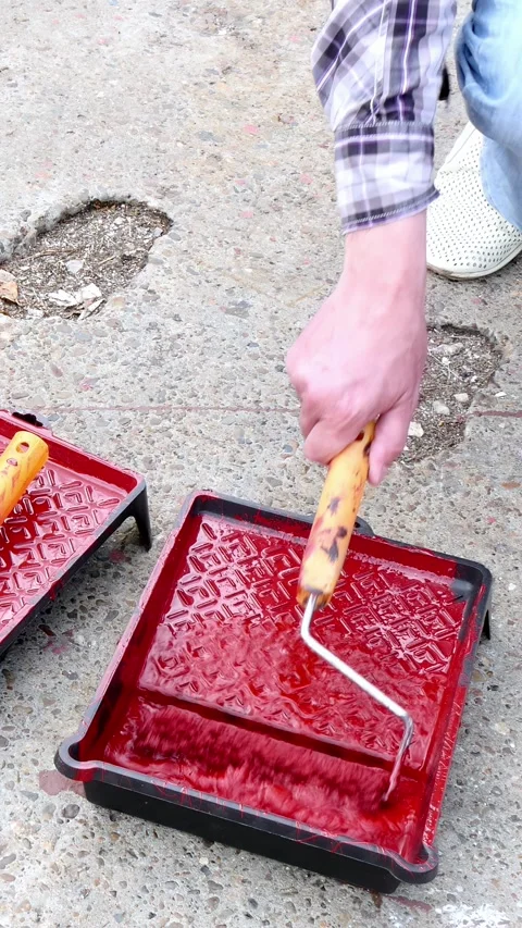Creative transformation of a worn-out pavement with vibrant red paint Video stock 298856875