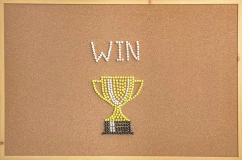 Creative Trophy Cup Design with the Word WIN Made from Push Pins on Cork Board Stock Photos