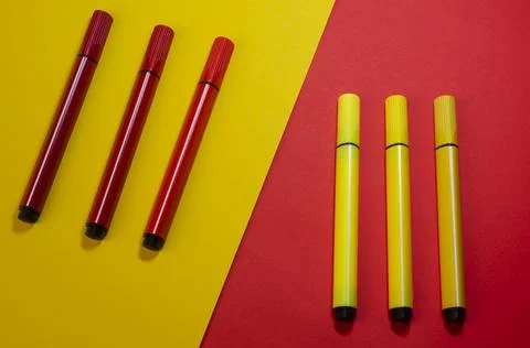 Creative two-color composition with red and yellow felt-tip pens. Stock Photos