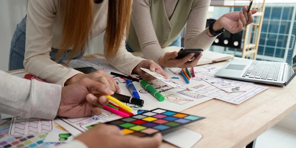 Creative UX Developer and UI Designer Brainstorming Session with Color Palettes Stock Photos