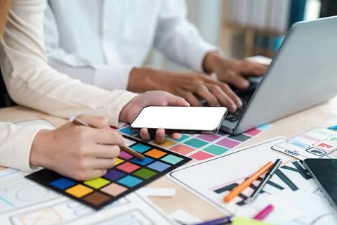 Creative UX UI Design Process with Mobile App Interface and Logo Concept on Desk Stock Photos