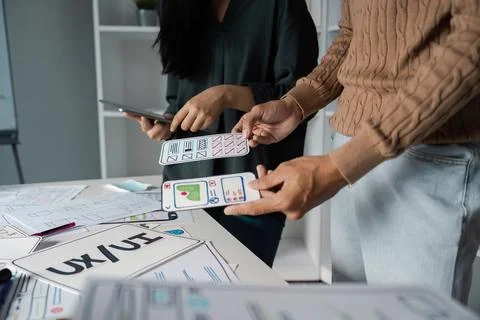 Creative UX UI Design Process with Designers Collaborating on Innovative Digital Stock Photos