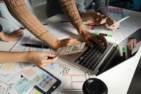 Creative UX UI Design Process with Team Collaborating on Mobile App Interface Stock Photos